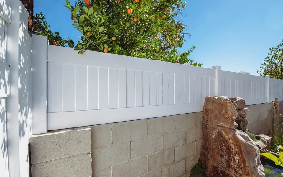 Privacy vinyl wall topper on residential wall